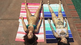 Badass brunette seducing busty babe by the pool